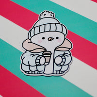 Load image into Gallery viewer, Cozy Winter Snowman Blue and Yellow Coat Sticker – Cute Snowman Vinyl Sticker – Hot Drink Snowman – Glossy Waterproof Sticker – Winter Aesthetic – 4.25cm x 6.18cm
