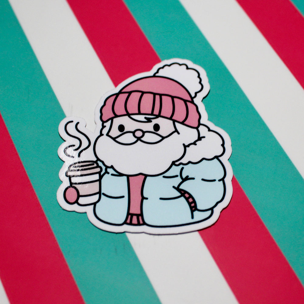 Cozy Santa Blue Coat Sticker – Cute Christmas Santa Vinyl Sticker – Hot Drink Santa – Glossy Waterproof Sticker – Festive Sticker – 5.29cm x 6.18cm
