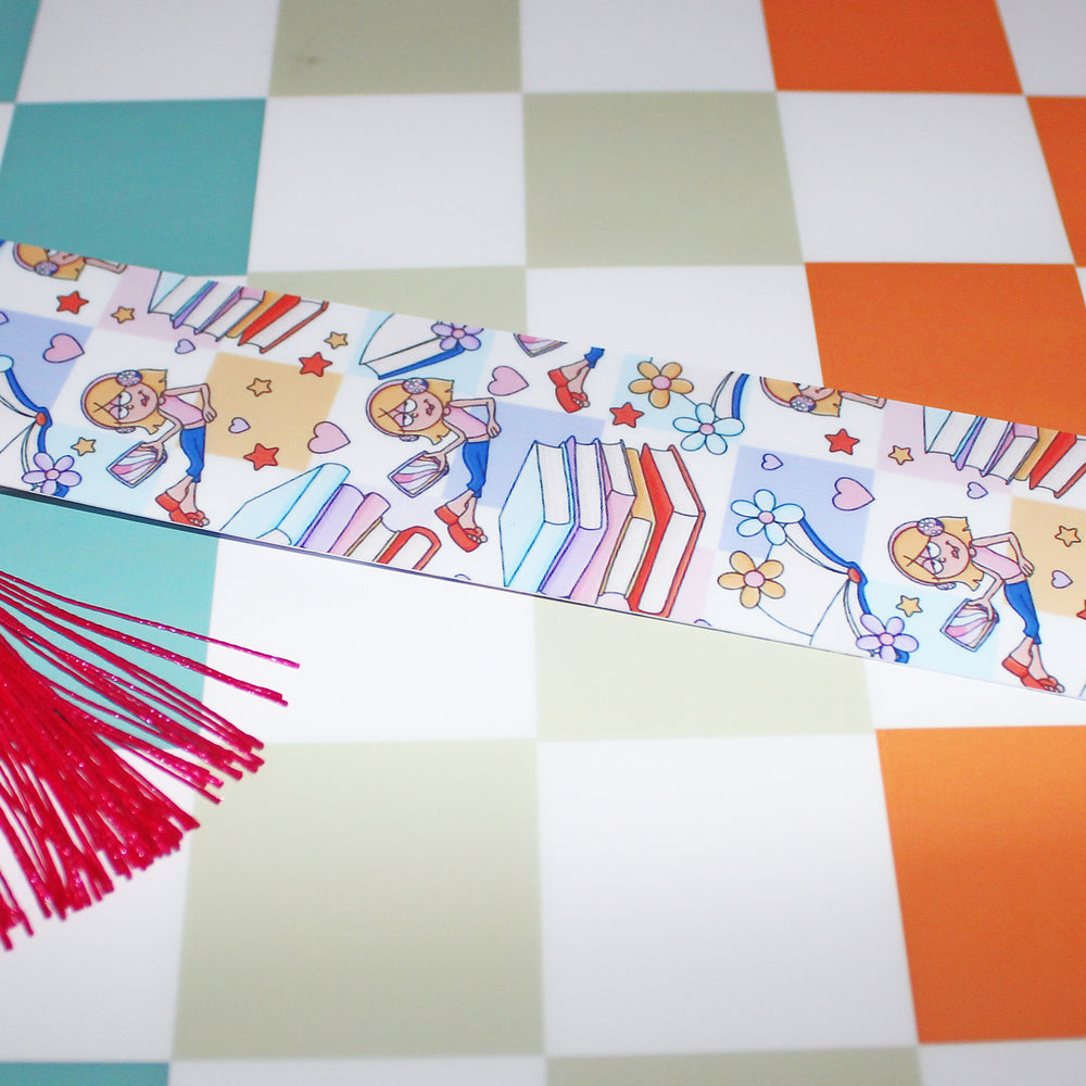 Decorative ribbon with cartoon characters and red tassel on a checkered background