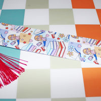 Load image into Gallery viewer, Decorative ribbon with cartoon characters and red tassel on a checkered background
