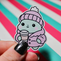 Load image into Gallery viewer, Winter Frog Pink Coat Sticker – Cute Pastel Cosy Aesthetic - Hot Drink Frog Vinyl Sticker - Gloss Waterproof -  3.99cm x 5.6cm
