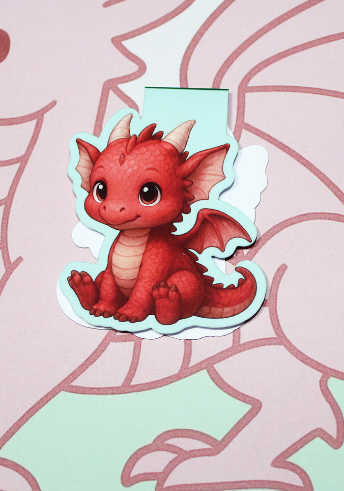 Magnetic bookmark of a red dragon on a pink and green background