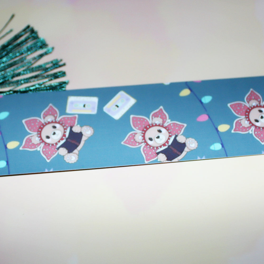 Decorative bookmark with cartoon characters on a blue background