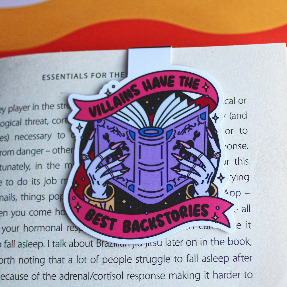 Book with a decorative Magnetic Bookmark on a colourful background