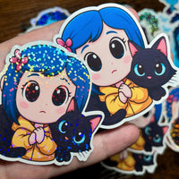 Load image into Gallery viewer, Cartoon character with blue hair and black cat on a hand, surrounded by more stickers.

