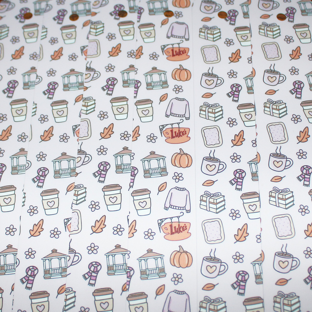 Patterned bookmarks with autumn-themed designs including pumpkins, leaves, and cozy items on a white background.