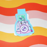 Load image into Gallery viewer, Colourful camera-shaped bookmark on a wavy striped background
