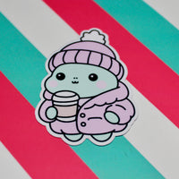 Load image into Gallery viewer, Winter Frog Pink Coat Sticker – Cute Pastel Cosy Aesthetic - Hot Drink Frog Vinyl Sticker - Gloss Waterproof -  3.99cm x 5.6cm
