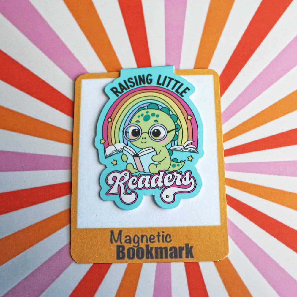 Magnetic bookmark with a cartoon character holding a rainbow and text on a colorful striped background