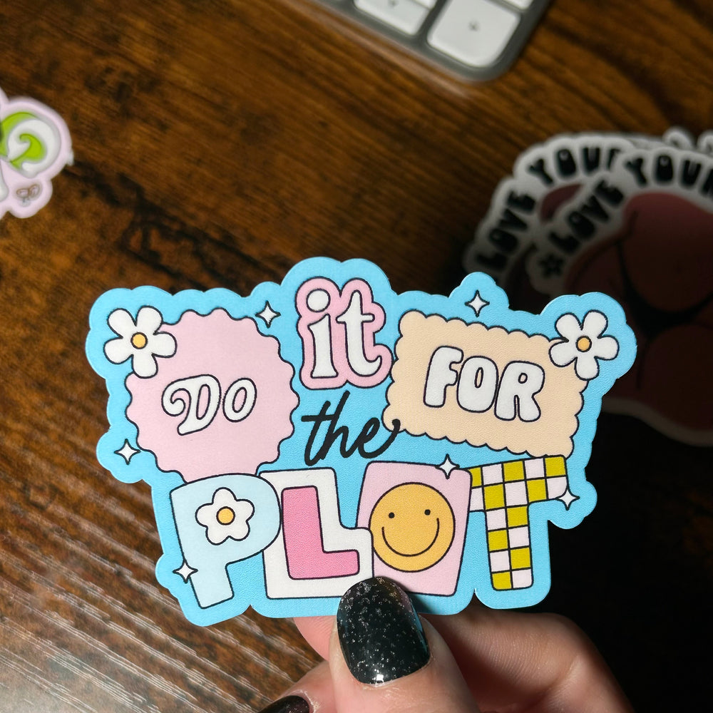 Sticker with text 'it do it for the plol' held by a hand on a wooden surface
