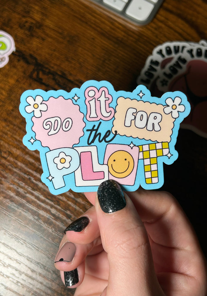 Sticker with text 'it do it for the plol' held by a hand on a wooden surface