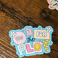 Load image into Gallery viewer, Colourful sticker with text and graphics on a wooden surface
