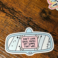 Load image into Gallery viewer, Sticker with motivational quote on a wooden surface
