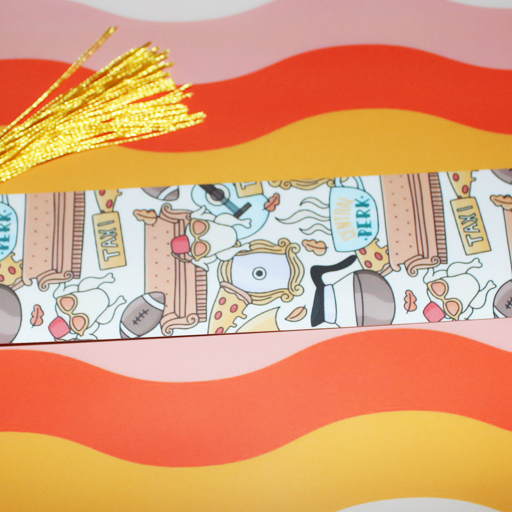 Decorative bookmark with tassel on a colorful striped background