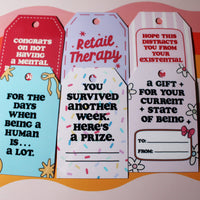 Load image into Gallery viewer, Four humorous gift tags with witty sayings on a colorful striped background
