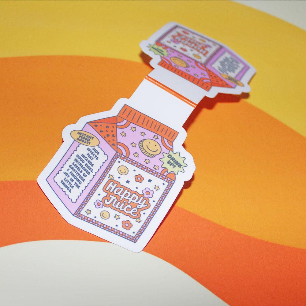 Colourful 'Happy Juice' bottle-shaped bookmark on a yellow and orange background