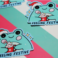 Load image into Gallery viewer, Feeling Festive Cute Frog Sticker - Christmas Frog with Hot Chocolate

