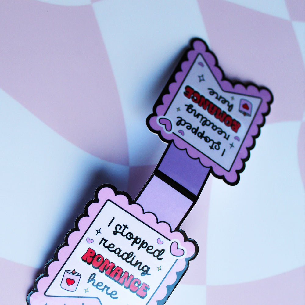 Purple bookmark with text on a pink and white checkered background