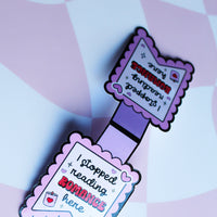 Load image into Gallery viewer, Purple bookmark with text on a pink and white checkered background
