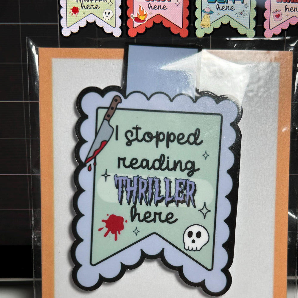 Magnetic bookmark with text and graphics on a clear background