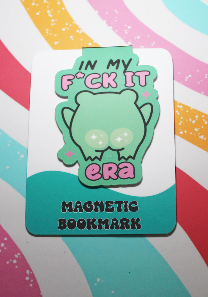 Magnetic bookmark with a cartoon frog design on a colourful striped background