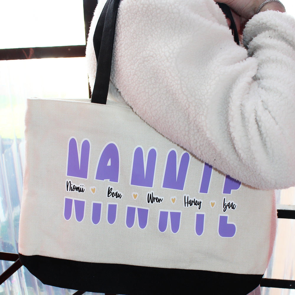 Tote bag with 'NANNIE' and children's names printed on it, held by a person.