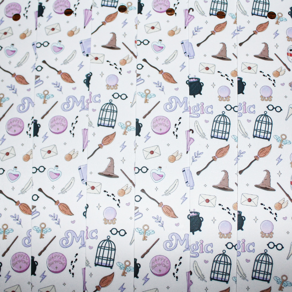 Pattern of magic-themed icons including brooms, hats, and potion bottles on a white background.