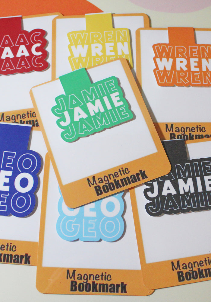 Set of colorful magnetic bookmarks with names on a multicolored background