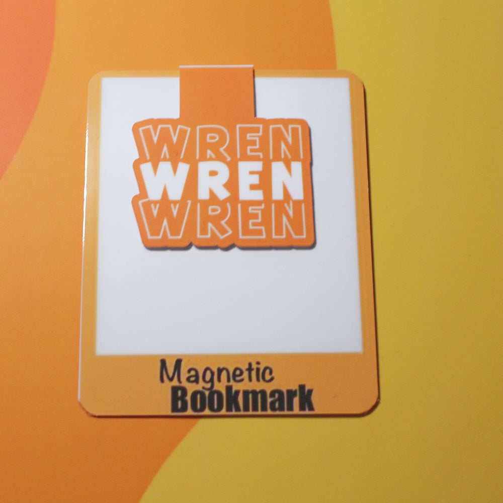 Magnetic bookmark with 'WREN WREN WREN' branding on an orange and yellow background