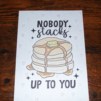 Load image into Gallery viewer, Card with a stack of pancakes and 'Nobody stacks up to you' text on a wooden surface
