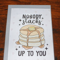 Load image into Gallery viewer, Card with a stack of pancakes and text 'Nobody stacks up to you' on a wooden surface
