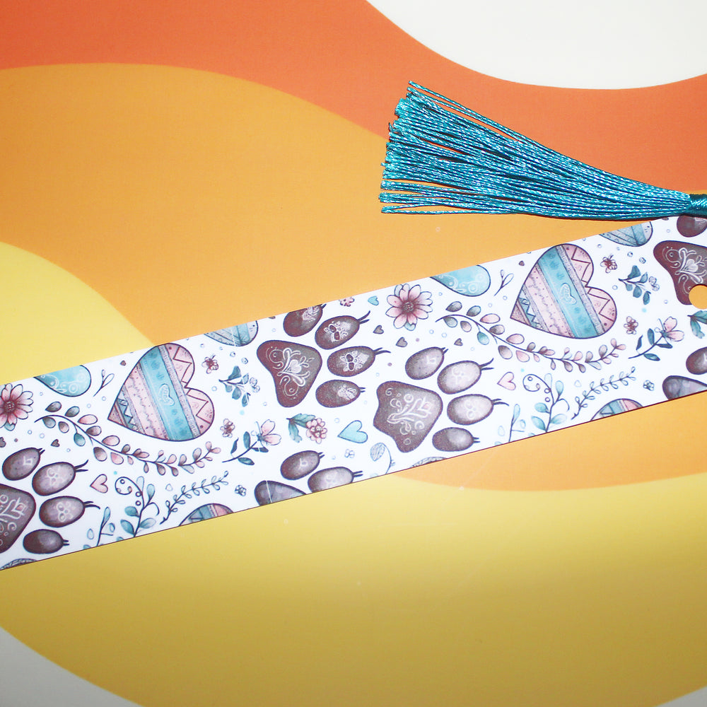 Decorative bookmark with floral and heart patterns on a colourful background