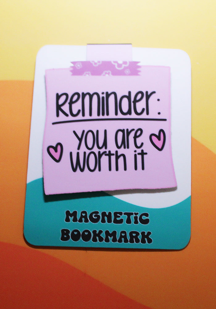Magnetic bookmark with motivational message on a colorful background