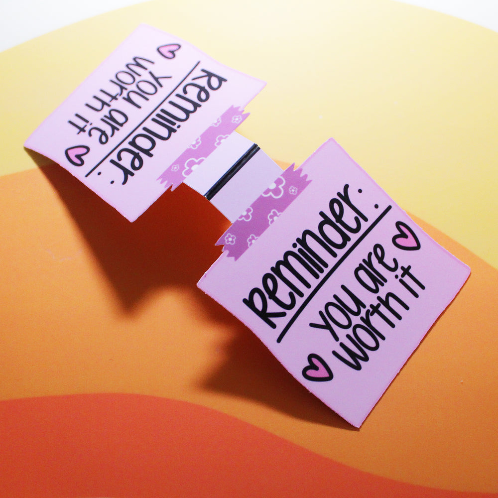 bookmark notes with motivational text on a colourful background