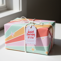Load image into Gallery viewer, Gift box with colorful pattern and 'Retail Therapy' tag on a light surface.

