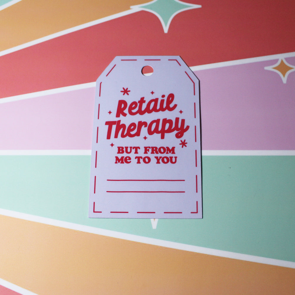 Gift tag with 'Retail Therapy, but from me to you' text on a colorful background