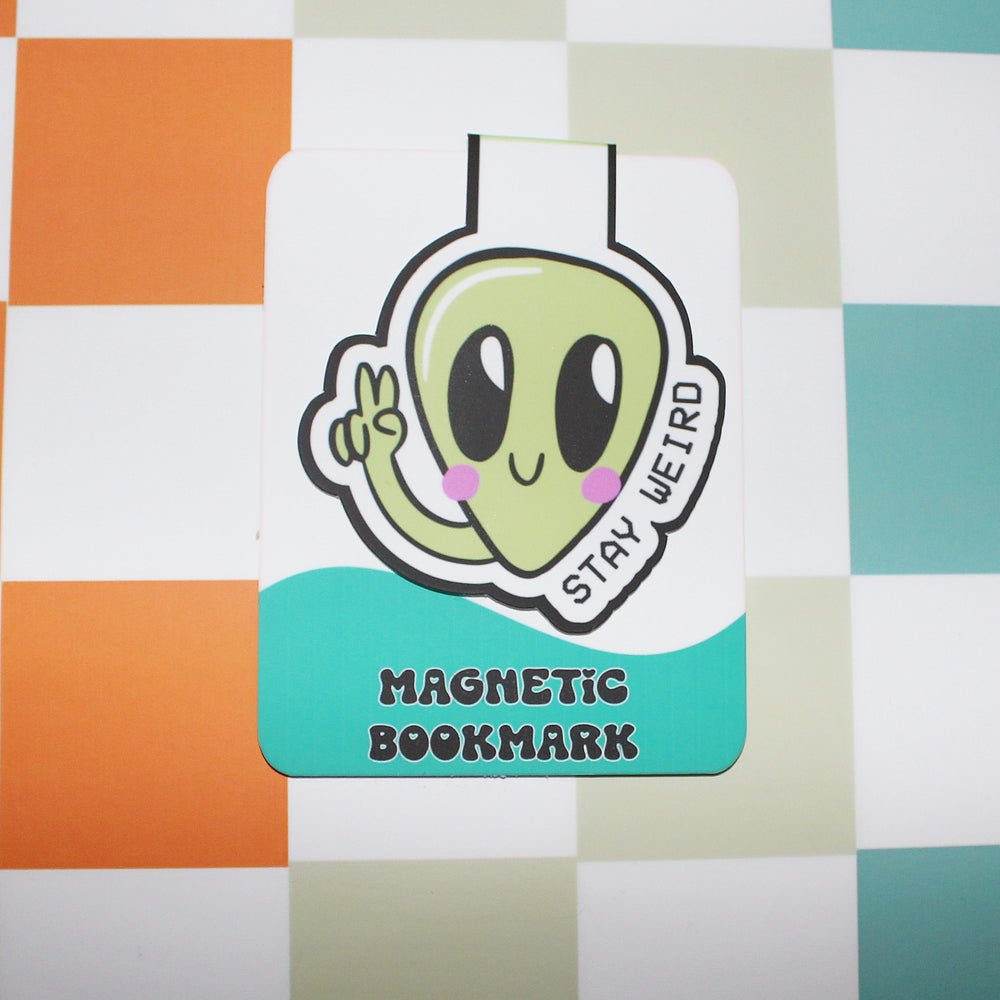 Magnetic bookmark with an alien design on a checkered background