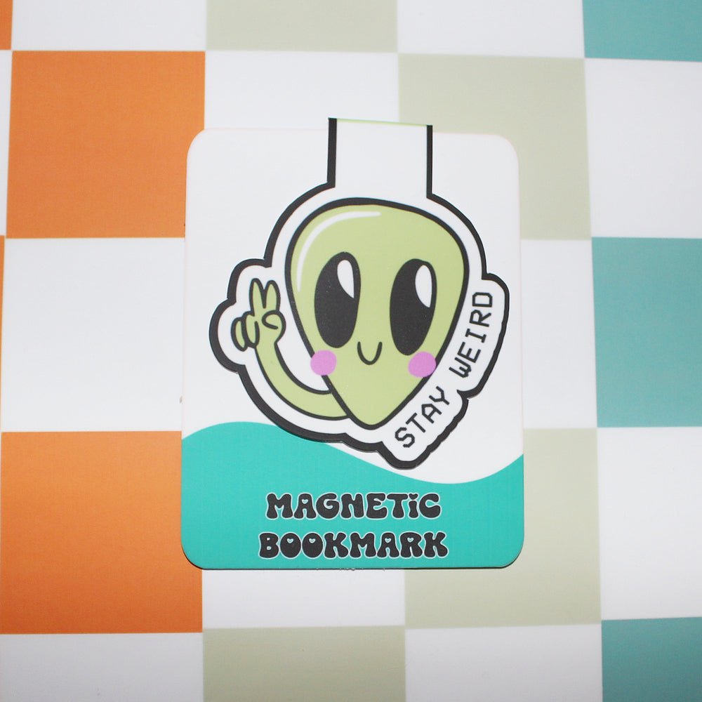 Magnetic bookmark with an alien design on a checkered background