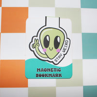 Load image into Gallery viewer, Magnetic bookmark with an alien design on a checkered background
