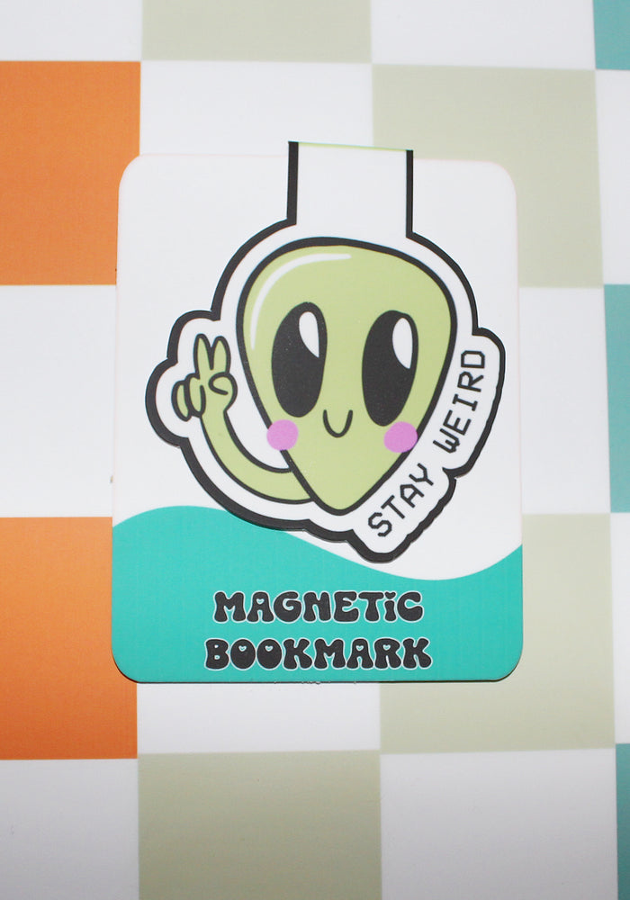 Magnetic bookmark with an alien design on a checkered background