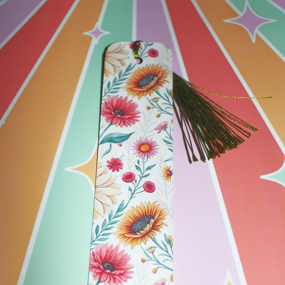 Floral bookmark with tassel on a colorful geometric background