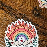 Load image into Gallery viewer, Sticker with rainbow design and text on a wooden surface
