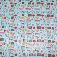 Load image into Gallery viewer, Patterned fabric with school-themed elements on a light blue background
