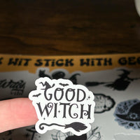 Load image into Gallery viewer, Sticker sheet with 'Good Witch' design held by a finger
