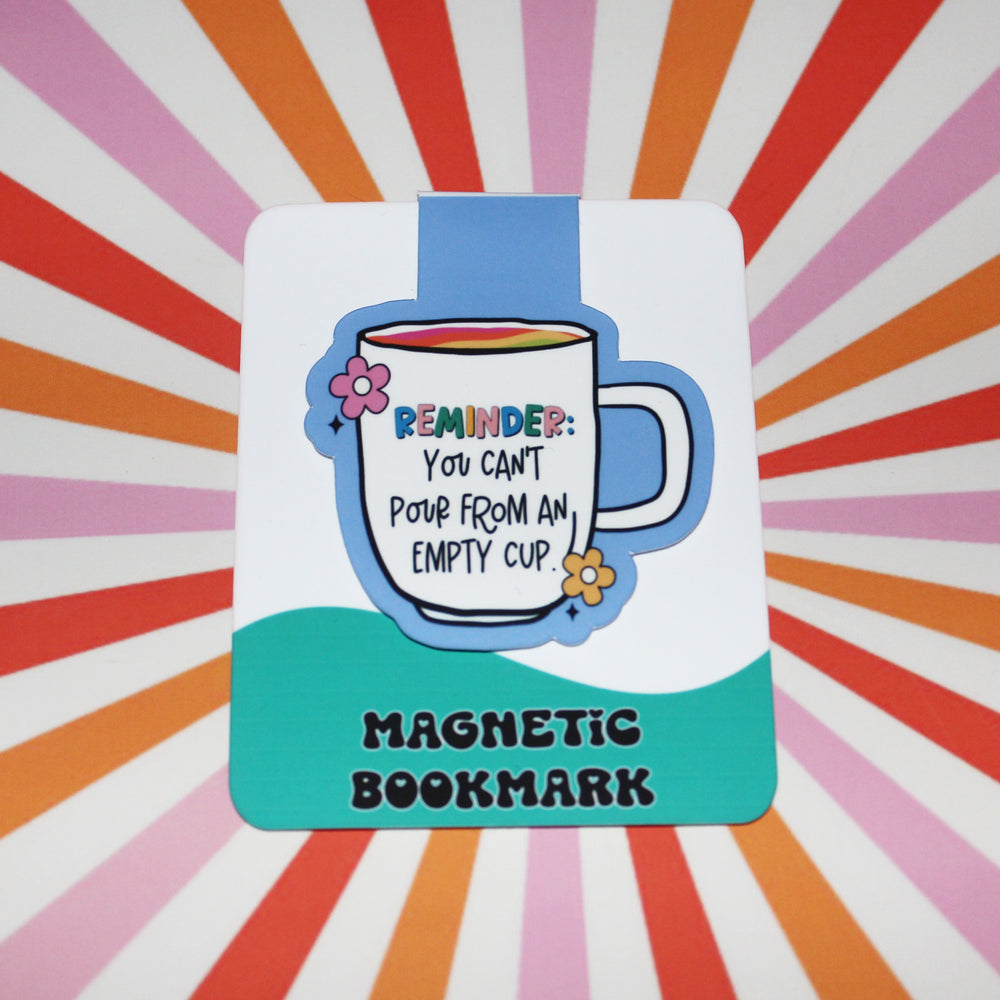 Magnetic bookmark with a mug illustration and text on a colorful radial background