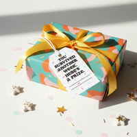 Load image into Gallery viewer, Colorful gift box with a yellow ribbon and a tag on a light background
