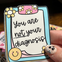 Load image into Gallery viewer, Card with 'You are not your diagnosis' message held by a hand with decorative nails.
