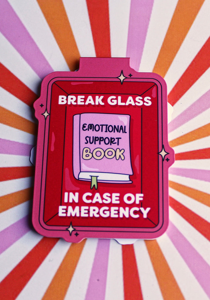 Pink book-shaped object with text on a multicolored radial background