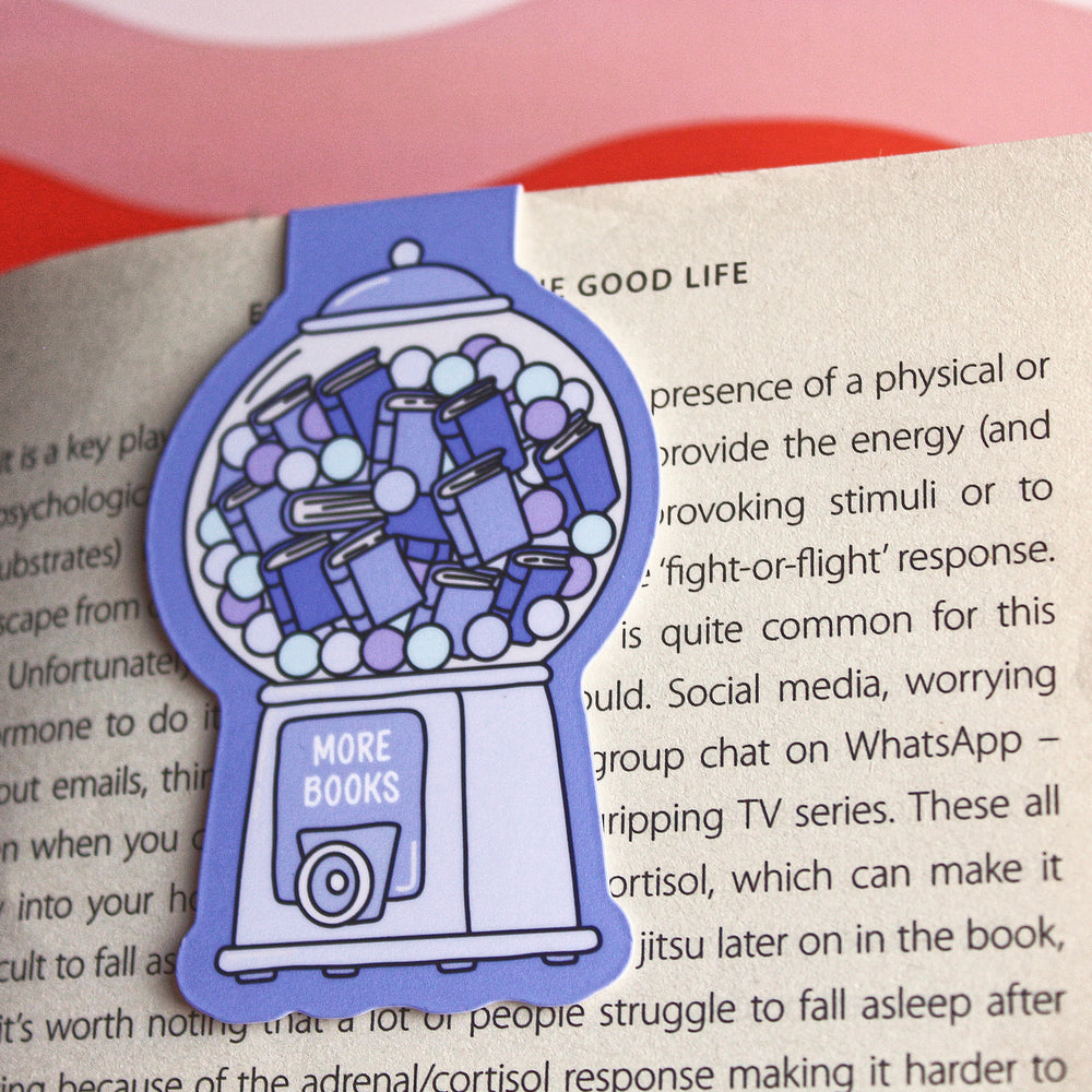 Gumball machine-shaped bookmark with 'More Books' text on an open book