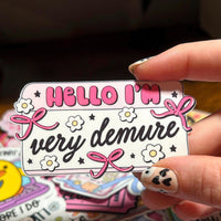 Load image into Gallery viewer, Hello I’m Very Demure Sticker | Cute Bow Aesthetic Sticker | Feminine Coquette Name Tag | Gloss Vinyl | Stick With Geo
